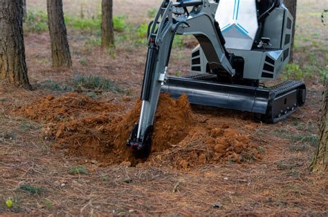 using a mini excavator for ditch cleaning|digging a ditch.